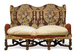 
	
		A William and Mary style sofa, first half 20th century, with serpentine shaped back and...