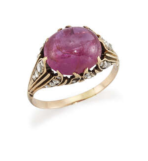 
	
		A pink sapphire single stone ring, the oval cabochon pink sapphire, weighing...