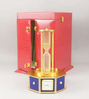 
	
		A gilt metal and blue glass presentation clock, of recent manufacture, the base of...