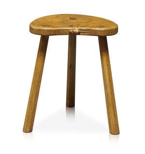 Robert Thompson (1876-1955), a Mouseman English oak three-legged stool
		c.1970, signed with a carved mouse on the side of the seat
		With kidney shaped seat
