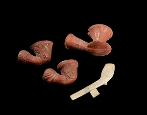 Three Ottoman tophane ware red clay carved pipes and another English pipe,Ottoman Empire, 19th...