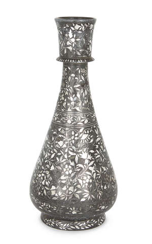 A silver inlaid bidri vase, North India, early 19th century, of a short, round foot, the...