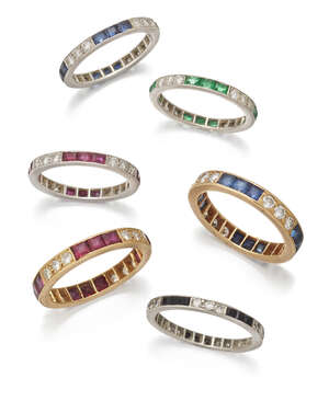 
	
		A group of six gem-set and diamond eternity rings, set with brilliant- and single-cut...