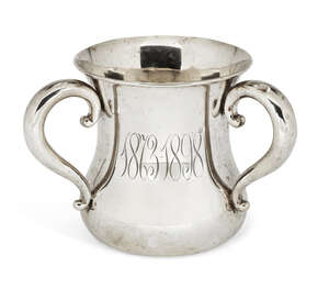 An American silver three-handled cup (tyg), of waisted form with scroll handles and monograms to body, the base with presentation engraving and the body dated 