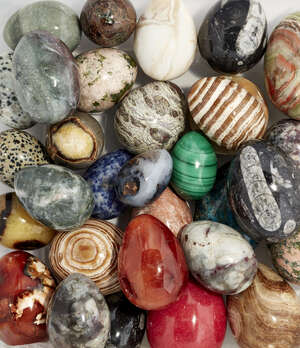 
	
		Thirty specimen mineral eggs, including malachite, agate, onyx and fossil marbles,...