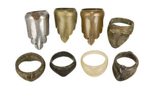 A group of Mughal archers rings, India, 17th-19th century, of brass, steel and one of ivory, three with perforated lobed edge (8)