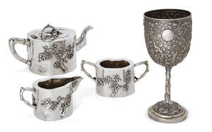 
	
		A Chinese three piece silver tea set a goblet, the goblet by Luen Wo, 19th century, the...