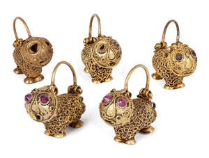 
	
		A group of five gold earrings in the form of small lions, Iran, 12th century, some with...