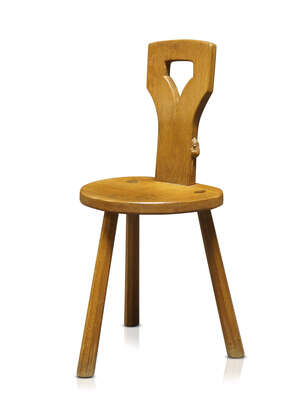 Robert Thompson (1876-1955), a Mouseman English oak spinning chair
		c.1970, signed with a carved mouse on edge of the back
		The shield shaped seat showing 