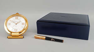 
	
		A presentation compendium travelling quartz alarm clock and pen, by Chopard, the clock ...