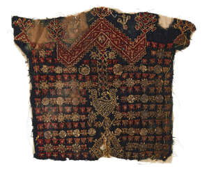 A Mamluk wool tunic fragment, Egypt or North Africa, 14th century, on a blue linen ground,...
