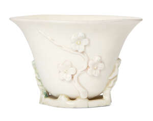 
	
		A Chinese Dehua libation cup, 17th century, moulded with flowering prunus blossom, 7.5cm...