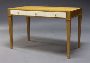 
	
		A modern oak desk, of recent manufacture, the rectangular top above three vellum drawers,...