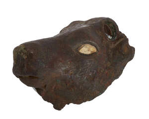 A Mesopotamian bronze bull head attachment, 3rd millenium B.C., with shell eye inlay remaining, attachment holes for horns at top of head, 14cm. long.
		 
	