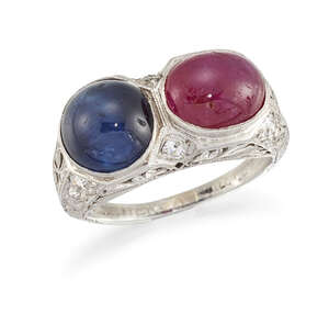 
	
		A ruby, sapphire and diamond ring, composed of an oval ruby cabochon and a circular...