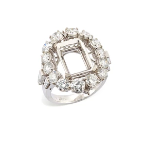 A diamond set ring mount, composed of a central rectangular-shaped vacant collet within...
