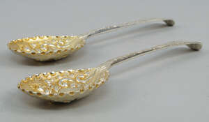 
	
		A pair of Georgian silver spoons, later chased into berry spoons, 21cm, approx 5.2oz...