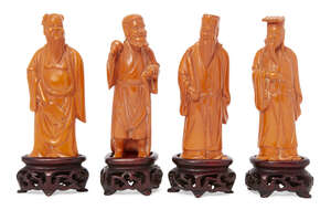 
	
		Four Chinese carved figures of Daoist immortals, early 20th century, each standing, on...