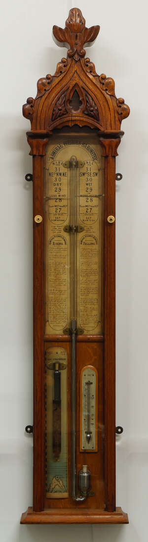 
	
		An Admiral Fitzroy's barometer, the oak case of Gothic form, with carved arched top,...