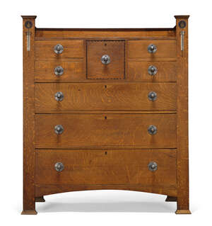 
	
		Attributed to E.G Punnett (British), an Arts & Crafts oak and inlaid chest of drawers...
