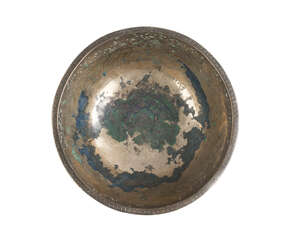 A Ghaznavid figural high-tin bronze bowl, Afghanistan, 12th century, of deep rounded form with slightly flattened base, decorated with chased, punched and engr