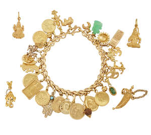 
	
		A charm bracelet and five loose charms,  the bracelet of fancy-link design suspending...