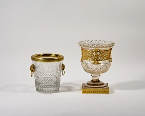 An English gilt-metal mounted cut glass wine cooler and a French gilt-metal mounted cut and...