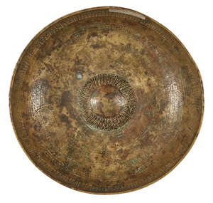 
	
		An Ottoman engraved brass magic bowl, Turkey, 17th century, of typical form, the exterior...