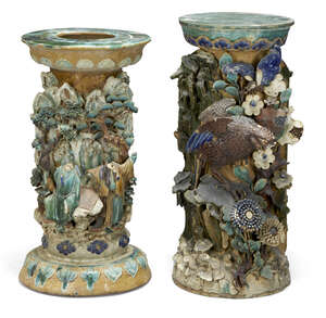 
	
		A pair of Chinese stoneware jardiniere stands, 19th century, decorated in high relief in...