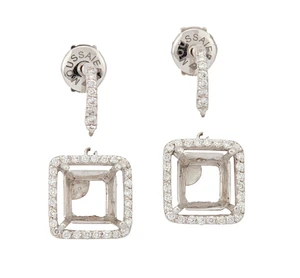 A pair of diamond set earring mounts with vacant principal collets, each designed as a vacant...