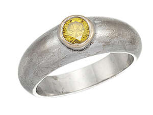 
	
		A treated yellow diamond single stone ring, the single collet-set circular-cut yellow...