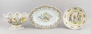 A Continental faience monteith, late 19th century, decorated to the body with daffodils and other flowers,marks to base, CBV above a crown, 18cm high, together