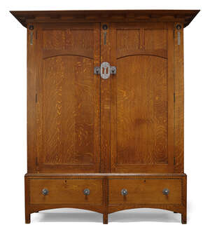 
	
		Attributed to E.G Punnett (British), an Arts & Crafts oak and inlaid wardrobe made by...