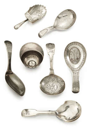 A George III silver jockey cap form caddy spoon, Birmingham c.1799, maker IT, together with six further silver caddy spoons (7)