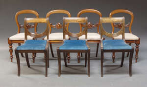 
	
		A set of four Victorian balloon back dining chairs, the splat with carved cabochon and...