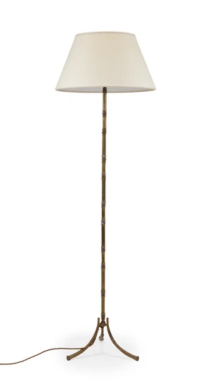 A faux bamboo brass standard lamp, mid-20th century, on splayed feet, with cream fabric shade, 134cm high
It is the buyer's responsibility to ensure that elect
