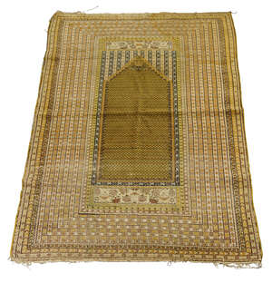 
	
		A Prayer rug, early 20th century, with ochre coloured prayer panel, surrounded by...