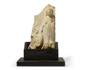 A Chinese limestone stele fragment with a standing bodhisattva
Northern/Eastern Wei period 
The bodhisattva standing on an oversized lotus wearing an elaborat