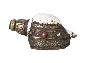 
	
		A tibetan ritual conch shell, 19th century, with repousse brass mounts decorated with a...