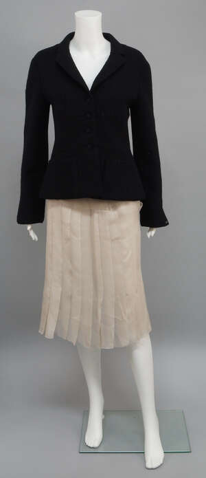 
	
		Chanel: a black wool short fitted jacket, with front patch pockets, size not labelled...