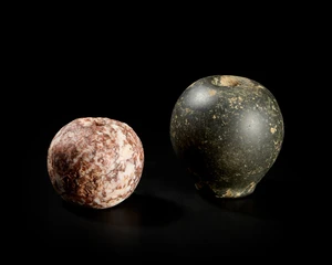 Two New Eastern limestone mace heads,Circa 3000 B.C.,
Of ovoid form, with tapering drill hole,...