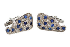 
	
		 A pair of sapphire and diamond cufflinks, each shaped panel with randomly-set...
