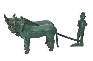 A bronze model of a farmer ploughing with bulls, Anatolia, 2nd millennium B.C, 21.5cm. long
		 
		Provenance: Acquired by the present vendor from a private 