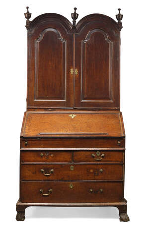 
	
		A Queen Anne oak bureau bookcase, the top surmount with three urn shaped finials above...