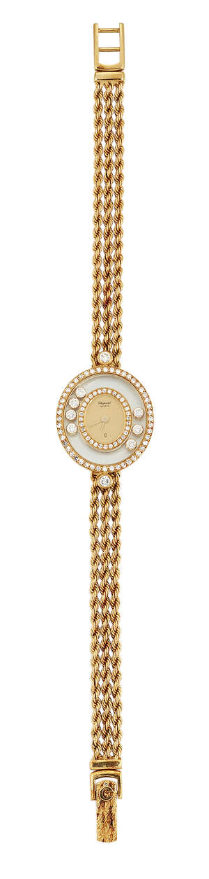 
	
		A lady's 'Happy Diamonds, quartz wristwatch, by Chopard, the central champagne dial...