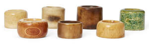 
	
		Seven Chinese bone, ivory, stained ivory, and horn archer's rings, 14th-19th century, 