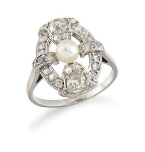 
	
		A platinum, diamond and pearl oval cluster ring, of openwork quatrefoil design, the...