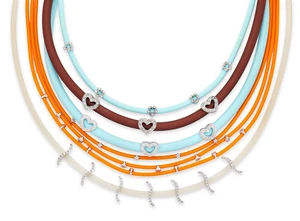 A group of five rubber necklaces, in brown, clear, pale blue or orange rubber of square or round...
