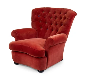 A modern easy armchair, with red velour upholstery and multi-coloured buttoned back, designed by Roger Jones, on bun feet
Provenance: Supplied and upholstered