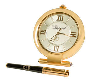 
	
		A presentation compendium travelling quartz alarm clock and pen, by Chopard, the clock...